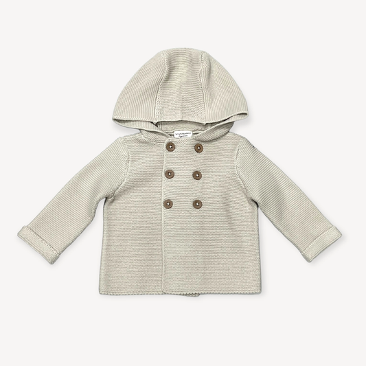 Hooded Double Button Baby Jacket, Stone Organic Cotton this Sweater Shown in 6 to 12 months.

Call for available Sizes, 303-744-7464